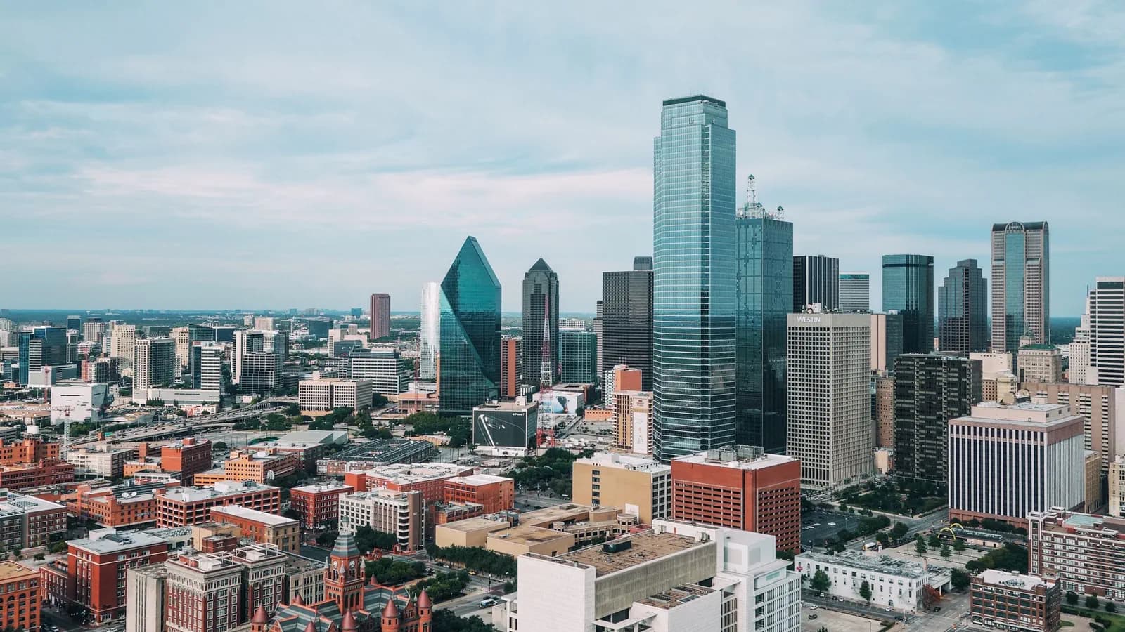 Downtown Dallas skyline from the air, with Bank of America Plaza, Fountain Place and the Old Red Museum turrets